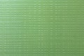 Green abstract geometric perforated textured background