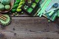 Green accessories for needlework on wooden background. Knitting, crochet, embroidery, sewing. Small business. Income from hobby.