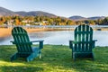 Green Adirondack Chairs a Facing a Mountain Lake Royalty Free Stock Photo