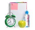 Green alarm clock, apple and bottle of water Royalty Free Stock Photo