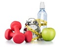 Green alarm clock, apple, bottle of water Royalty Free Stock Photo