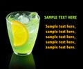 Green alcohol cocktail with lemon slice isolated on black Royalty Free Stock Photo