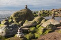 Green algae covered boulders at sea coast beach. Royalty Free Stock Photo