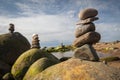 Green algae covered boulders at sea coast beach. Royalty Free Stock Photo