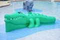 Green Alligator fountain in a water park