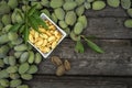 Green almonds open background fresh raw unripe wooden rustic table blurred garden background leaves, Top view copy space shell Royalty Free Stock Photo