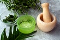 Green aloe vera gel next to natural ingredients for cosmetics. Face and skin care Royalty Free Stock Photo