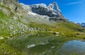 Green alpine Aosta valley lake with Matterhorn summit in the Alps Royalty Free Stock Photo