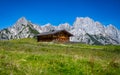 Green alpine meadow with wooden hut in front of impressive mountain peaks, Salzburg, Austria, Europe Royalty Free Stock Photo