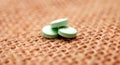 green antidepressant pills on small jute bag background Royalty Free Stock Photo