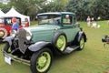 Green Antique american car in lineup