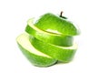 green apple and apple slices on a white background Royalty Free Stock Photo