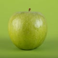 Green apple with green background