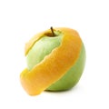 Green apple covered with orange peel Royalty Free Stock Photo
