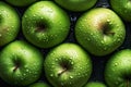 A green apple covered in water droplets. Apple background.