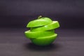 Green apple cut and isolated on dark background Royalty Free Stock Photo