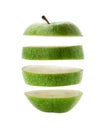 Green apple cut into slices isolated over a white Royalty Free Stock Photo