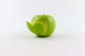 Green apple with cutout heart turned left on white background Royalty Free Stock Photo