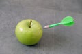 Green apple and dart, to be committed to losing weight Royalty Free Stock Photo