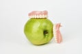 Green apple and dentures on white background Royalty Free Stock Photo