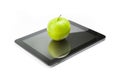 Green apple on digital tablet pc on white background Royalty Free Stock Photo