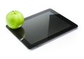 Green apple on digital tablet pc on white background Royalty Free Stock Photo