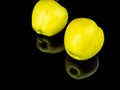 Green apple fruit on a black glass background with reflection Royalty Free Stock Photo