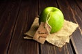 Green apple gift with thank you lable on dark wooden table background. Teachers day Royalty Free Stock Photo