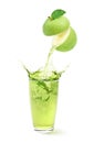 Green apple juice pouring into the glass with splashing Royalty Free Stock Photo