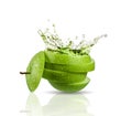 Green apple juice splashing with its fruits Royalty Free Stock Photo