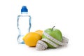 Green apple, lemon and bottle water with measuring tape Royalty Free Stock Photo