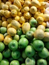 Green apple and lemon at local store at fruit section Royalty Free Stock Photo