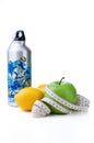Green apple, lemon and sport bottle with measuring tape Royalty Free Stock Photo