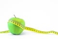 Green apple and measuring tape