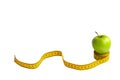 Green apple and measuring tape  with centimeters and inches isolated on white background Royalty Free Stock Photo
