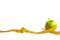 Green apple and measuring tape  with centimeters and inches isolated on white background Royalty Free Stock Photo