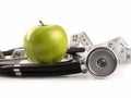 Green apple and measuring tape on white Royalty Free Stock Photo