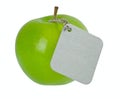 Green apple with metal tag Royalty Free Stock Photo