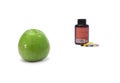 Green apple and pills Royalty Free Stock Photo