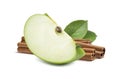 Green apple quarter piece cinnamon in the back isolated Royalty Free Stock Photo