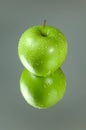 Green apple reflection Royalty Free Stock Photo