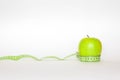 Green apple and the ruler Royalty Free Stock Photo