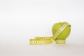 Green apple and the ruler Royalty Free Stock Photo