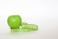 Green apple and the ruler Royalty Free Stock Photo