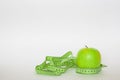 Green apple and the ruler Royalty Free Stock Photo