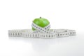 Green apple with a ruler Royalty Free Stock Photo
