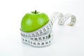 Green apple with a ruler Royalty Free Stock Photo