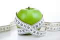 Green apple with a ruler Royalty Free Stock Photo