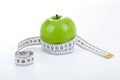 Green apple with a ruler Royalty Free Stock Photo
