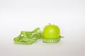 Green apple and the ruler Royalty Free Stock Photo